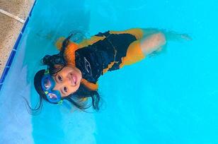 Young swimmer smiling during a private swim lesson