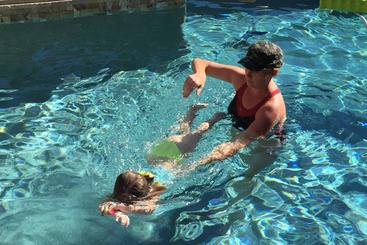 One-on-one swim lesson with a child building water confidence